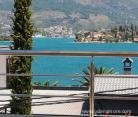 Apartment in a house with a private beach, private accommodation in city Krašići, Montenegro